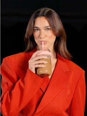 @Dua Lipa on the move, coffee in hand ☕️