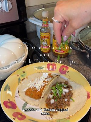Must-try Frijoles Puercos and Steak Tacos ✨ #ad #CholulaPartner @Cholula Hot Sauce #cholula #cremosa #cholularecipes  Ingredients for frijoles puerco:  • 3 lbs of mayocoba beans (frijoles peruanos) • Salt (to taste) • 1 cup of pork lard • 3 corn tortillas (store bought or homemade) • 18 ounces of pork chorizo •  9 cups of bean broth  • 3 pickled jalapeños, finely chopped • 3 chipotle peppers in adobo sauce, finely chopped • 3 tablespoons of Cholula® Original Hot Sauce • Queso fresco Ingredients for beef tacos • 1/2 tbsp Oil • 3.5 lbs of beef (I used 100% grass fed beef) • 2 packets of Cholula® Original Taco - Medium Recipe Mix • Handmade corn tortillas (or store bought) • 3 avocados • Cholula® Original - Medium Salsa Recipe: 1. In a large pot with four quarts of boiling water, add 3 lbs of rinsed mayocoba beans (frijoles peruanos). Reduce heat to low-medium and cover for about 1.5 hours. 2. Cut beef into bite-size pieces. 3. Heat up half tablespoon of oil in a pan. Once it's hot, add your meat in and stir. 4. Season with two packets of Cholula® Original Taco - Medium Recipe Mix. Stir again, reduce heat to low and cover for 20 minutes or until tender. 5. At the 1.5 hour mark, add salt to taste to your pot of beans. Cover again for another hour or until they’re nice and soft. 6. In another pot, on medium- high heat, melt 1 cup of pork lard. 7. Rip 3 tortillas in pieces and fry in lard until golden. Drain tortilla chips on paper towel-lined bowl. Reduce heat to medium. 8. In that same pot I’m going to add my chorizo, slightly covering with a lid to avoid splattering. Break apart and cook for about 4-5 minutes 9. Add your beans in along with the cooking liquid and tortilla chips. Cover and let simmer for about 10 minutes. 10. Uncover and add pickled jalapeños, chipotle peppers and Cholula® Original Hot Sauce. Stir to combine. 11. Mash everything by hand with a potato masher or use a hand blender/blender for a smoother consistency. Turn heat off. 12. Serve to your liking. I topped my steak tacos with onion, cilantro, avocado and Cholula® Original - Medium Salsa and my frijoles puercos tacos with crumbled queso fresco. Enjoy!