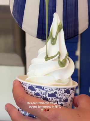 This cult-favorite froyo spot opens tomorrow in NYC 🍦 Another froyo just entered the NYC scene. It was founded in Madrid and has already expanded to 16 countries—this is only their second U.S. location. They use Greek yogurt imported weekly from Greece and make everything fresh in-store daily. The space feels like a mini Santorini—white stucco walls, curved arches, soft lighting, etc. I tried both the original and the yuzu yogurt and loved both, but the original is still my favorite—it’s a little thicker and has that classic slightly tart Greek yogurt taste. The toppings bar is what makes this stand out. Over 30 options, but not the usual candy overload—more Mediterranean: baklava, pistachio cream, pistachio crumble, mixed nuts, fig compote, etc. I love the baklava + mixed nuts (with goji berries) one since I like that extra crunch. Right now they have three bases: natural Greek yogurt, yuzu yogurt, and peach sorbet (you can also mix). Prices are $8.90 (1 topping), $10.90 (2 toppings), $12.90 (3 toppings), +$1.50 for extras. 📍Myka Greek Frozen Yogurt 🗺️ 159 7th Ave S, New York, NY 10014 💵 $8.90 | $10.90 | $12.90 . #frozenyogurt #froyo #nyc #newyork #nycfood 