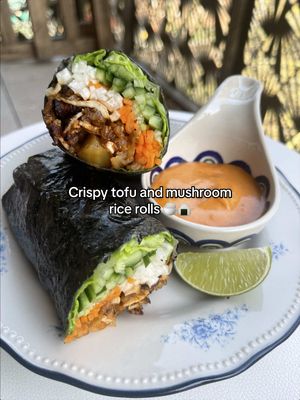 Sticky, CRISPY mushroom and tofu rice rolls 🌶️ This sits somewhere between Kimbap and a summer roll and though I love both OG dishes, I wanted to try something that requires no hands on cooking. For these, just chuck some shaved mushrooms and tofu onto a try with leftover or packet sticky rice plus the most UNBELIEVABLE sauce that you'll want to drink.That goes into the oven then you're ready to assemble. TOO EASY!! Perfect for a quick lunch at home or packed up and taken into the office (which is literally what I did today and I'm very satisfied x) RECIPE 1 large king oyster, shredded  ½ block smoked tofu, shredded  260g leftover or packet sticky rice 3 tbsp soy sauce 1.5 tbsp sesame oil 1.5 tbsp brown sugar 1 tbsp veg oil 1.5 tbsp gochujang 1 tbsp ginger, grated 2-3 cloves garlic, grated Roast for 30-35 mins at 200 degrees until crispy and sticky. Serve with Kimoni and any veg you want (I'd recommend cuc, carrot, daikon and lettuce). Enjoy ✨✨ #tofu #ricerolls #crispyrice #veganrecipe 