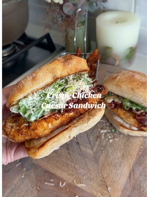 CHICKEN CAESAR BURGERS  a delicious dinner or lunch option for the warmer weather ☀️ Follow @kimberlys_journeyy for more recipes like this⤵️ To make the chicken: - 400g chicken breast  - 25g panko breadcrumbs  - 10g parmesan  - 1 whisked egg - 1tsp smoked paprika, garlic granules & chicken seasoning  The burgers: - two ciabatta buns  - Chopped romaine lettuce - 2tbsp light caesar dressing  - 10g parmesan  - 2tbsp hot honey - 2 sliced cooked bacon medallions  Mix together the panko breadcrumbs with parmesan and half of the smoked paprika, garlic granules and chicken seasoning. Butterfly your chicken breasts and slice them so they are nice and thin. Sprinkle over the rest of the seasonings. Then dip each piece into the whisked egg, then coat well in the breadcrumb mix, pressing it on so it sticks. I cooked mine in the air fryer at 200°C for 12–15 mins, flipping halfway, until golden and crispy (or pan fry for 4–5 mins each side until cooked through). Slice and lightly toast your ciabatta buns until golden but still soft. Mix the chopped romaine lettuce with the caesar dressing and parmesan. Add the chicken to the bottom of your ciabatta rolls, top with the salad and finish with the bacon medallions and a little extra parmesan. #chickencaesarsandwiches #essyrecipes #chickensandwhich #crispychicken #chickencaesar 