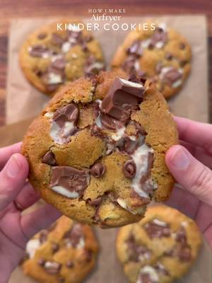 Crispy edges, soft and gooey center Airfryer kinder cookies  I made this using @typhur_culinary Dome 2 Airfryer. It bakes evenly and gives that perfect crisp every time. Fast, efficient, and honestly makes baking so much easier. You can use my code ‘COOKWITHSHA’ to get 10% off😉 Yields: 8-9Cookies INGREDIENTS: •115g cold chopped unsalted butter •80g caster sugar •80g light brown sugar •150g Kinder chocolate, chopped into chunks, plus an extra 50–60g for topping after baking. •238g plain flour  •½ tsp salt •1½ tsp baking powder •¼ tsp baking soda •1 egg + egg yolk  •½ tsp vanilla INSTRUCTIONS: •In a large mixing bowl, add the cold cubed butter and whisk until slightly creamy. Add the white sugar and light brown sugar, then whisk together until well combined and fluffy. •Add the eggs, vanilla extract, and Whisk until fully incorporated. •Add the flour, baking powder, baking soda, and salt. Also add kinder chunks and Gently mix until just combined, do not overmix.  •Portion the dough into 90-95g balls. •Place the cookie dough balls onto a tray and freeze for at least 30 minutes (or overnight for best results). •Preheat airfryer to 175 (350°F). Bake for 10-12 minutes or until the tops are lightly golden while the centres remain soft. •Remove from the airfryer and top it up with more kinder chunks and chocolate chips (option) and let it cool  •Serve warm with ice cream. NOTE:  •Let the cookies set for at least 30 minutes. Open the air fryer and let them cool inside for 10 minutes before removing, then allow to set fully or they may break. •FREEZING IS IMPORTANT. •Store any extra dough balls in an airtight container or freezer bag and freeze for later. Whenever a cookie craving hits, bake straight from frozen🫶🏻 #cookie #kindercookies #airfryer #fyp #explorepage✨ 