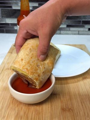 Lets go Start your day with a chicken fried bacon, sausage and egg breakfast burrito Tapatio hot sauce adds the heat to make every breakfast burrito better