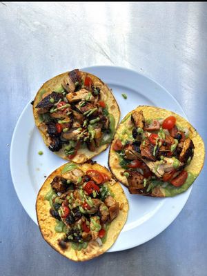 AD Charred lemon chicken tacos, all cooked in the pizza oven and made with my secret weapon @Taylor&Colledge International Extract.    Smoky, fresh and full of flavour, with juicy chicken thighs, a chunky tomato salsa, and a creamy green salsa made with charred veg, avocado, lime and coriander. Finished with fresh chilli, extra herbs and a squeeze of lime. Only a few drops of Taylor & Colledge’s Oil Based Lemon Extract goes straight into the marinade to lift the whole dish with a bright lemon hit.    Charred Lemon Chicken Tacos   Ingredients 6 boneless chicken thighs 2 tbsp olive oil 2 garlic cloves, finely grated 1 tsp smoked paprika 1 tbsp honey A few drops Taylor & Colledge Lemon Extract Salt and black pepper Small tortillas   For the chunky salsa 3 ripe tomatoes, finely chopped 1/2 white onion, finely diced 1 handful coriander, chopped Juice of 1 lime Salt and black pepper   For the green salsa 2 ripe avocados 2 spring onions 1 green pepper 2 green tomatoes 1 handful coriander Juice of 1 lime Salt and black pepper Olive oil   To finish Fresh red chilli, finely sliced Extra coriander Lime wedges   Method Marinate the chicken thighs with the olive oil, garlic, smoked paprika, honey, seasoning, and a few drops of Taylor & Colledge Lemon Extract. Leave for at least 30 minutes. Cook the chicken thighs in the pizza oven until nicely charred and cooked through, turning as needed so they get good colour on the outside. Rest for a few minutes, then slice. Make the chunky salsa by mixing the chopped tomatoes, white onion, coriander, lime juice, salt and black pepper together in a bowl. Set aside. For the green salsa, char the spring onions, green pepper and green tomatoes in the pizza oven until softened and lightly blackened. Add to a blender with the avocado, coriander, lime juice, a little olive oil, salt and black pepper, then blend until smooth but still with a little texture. Warm the tortillas, then fill with the sliced charred chicken. Spoon over the chunky salsa and green salsa, then finish with fresh chilli