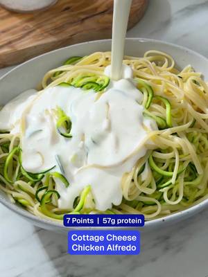 The 7-Point Alfredo hack you didn’t know you needed. 🍝 Ingredients: Uncooked linguini, 8 oz Fat free cottage cheese, 1 pound 2% reduced fat milk, ½ cup Garlic, 1 clove Kosher salt, ¾ tsp Black pepper, ¼ tsp Grated Parmigiano-Reggiano, 1 Tbsp Fresh zucchini spirals, 1 pound Cooked skinless boneless chicken breast, 1 pound, thinly sliced or shredded Grated Parmigiano-Reggiano, 4 tsp Recipe: 1. Heat large pot of salted water to boiling on high. Cook linguine according to package. 2. Before draining pasta, save 1/4 cup pasta water and stir the zucchini noodles into the pot. Drain immediately. 3. While pasta cooks, in a blender, puree cottage cheese, milk, garlic, 1 Tbsp Parmigiano cheese, salt, and pepper until smooth. 4. Toss drained pasta-zucchini mixture with the cheese sauce. If sauce is too thick, add splash of reserved pasta cooking water and toss to coat. 5. Divide pasta among 4 plates. Top each with 4 oz chicken and 1 tsp grated Parmigiano cheese. Season with additional pepper, if desired.