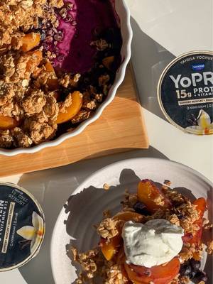 your morning just got a major upgrade 🍑🫐  this peach and blueberry crumble is one recipe you simply cannot miss!  ingredients: the fruit base 3 large peaches, sliced (tinned or fresh) 1 cup blueberries 1 tsp vanilla extract 1 tsp cinnamon the protein crumble 2 cups oats 3 tbsp peanut butter 3 tbsp honey 1 tsp cinnamon pinch of salt to serve YoPRO vanilla yoghurt method: 1. preheat your oven to 180°c. 2. in a large bowl, mix the oats, peanut butter, honey, cinnamon, and salt until crumbly. 3. in an oven-proof dish, toss the peaches, blueberries, vanilla, and cinnamon until well coated. 4. top the fruit with your crumble mixture and gently flatten. 5. bake for 30-35 minutes until the fruit is tender. tip: if the top browns too fast, cover with foil! 6. let it cool slightly, then dollop with plenty of YoPRO vanilla yoghurt and an extra drizzle of honey. #CrumbleRecipe #Peach #Blueberry #BerryCrumble