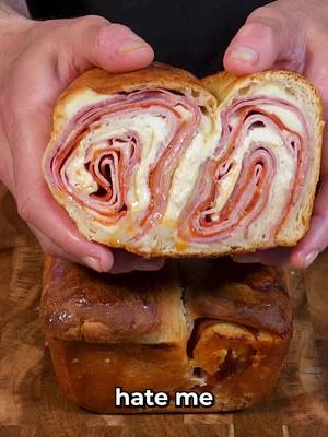 Stuffed Italian Combo Sandwich INGREDIENTS & RECIPE (Makes 3 large sandwiches) 2 tbsp olive oil, 2 tbsp oregano, 1 tbsp red wine vinegar, 2 (16 oz) refrigerated pizza doughs, 24 provolone slices, 18 salami slices, 8 mortadella slices, 24 pepperoni slices, 8 smoked ham slices, 1 egg + 1 tbsp water, 3 cups shredded iceberg, 3 tomato slices. Mix oil, vinegar & oregano. Roll out dough and brush with the mixture. Layer provolone, salami, mortadella, provolone, pepperoni & ham. Roll tightly and place 2 rolls side-by-side in loaf pan. Brush egg wash on top and bake at 400F for 25 mins. Rest 15 mins, slice, then fry each side for 2 mins. Toss lettuce in remaining dressing, add lettuce & seasoned tomato, then enjoy!