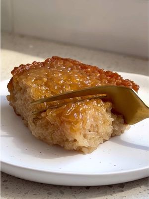 Easy Filipino Sticky Rice Biko Recipe 🍚 When I was a little girl my brother and I used to have a Filipino babysitter, and she would make this often for parties and celebrations she’d bring us to! When I went back to the Philippines a few years ago I made it my life’s mission to find some again.  When I came back home I decided to make my own. This stuff is SO SOOO GOOD I cannot even explain it.  INGREDIENTS YOU NEED - Glutinous rice (yes you need this specific type of rice) Full-fat coconut milk Water Dark brown sugar Salt Full recipe is on the blog! Linked in bio or can search https://basicswithbails.com/course/dessert/easy-biko-recipe/ #easydessert #easydessertrecipe #filipinodessert #filipinorecipes #biko 
