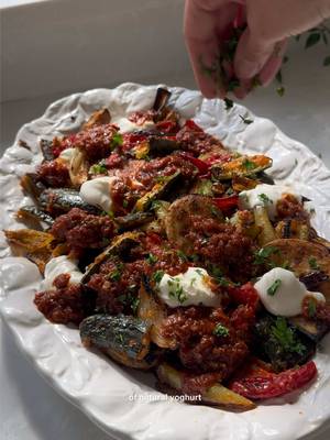 Ok, let me show you how I turn my vegetables into THE main event 💜❤️🧡💛💚🤎 Flavoursome, fried and crispy vegetables are known as “Sebze Kızartması” or simply “Kızartma”. Kızartma means ‘to fry’ or ‘frying’, but since these vegetables are oven baked, the crispy texture is achieved with a spicy cornflour coating. The vegetables are elevated with the chilled yoghurt and an utterly delicious sweet, tangy and garlicky pomegranate molasses garlic sauce, and I promise you that this dish will convert anyone with a vegetable aversion to fall in love with everything on this platter. Full recipe on my blog (link in bio) and in Dinner Tonight. #PleaseMakeIt S E RV E S 6 For the vegetables: 6 tbsp olive oil 4 tbsp cornflour 2 tsp dried oregano 2 tsp garlic granules 2 tsp paprika 1 tsp coarse black pepper 2 medium baking potatoes, sliced into 1½cm (5/8in) rounds 2 medium aubergines, cut into 3 x 6cm (1¼ x 2½in) batons 2 onions, peeled and cut into 4 wedges (the root still intact to hold the layers together) 1½ tsp sea salt flakes 2 large courgettes, cut into 3 x 6cm (1¼ x 2½in) batons 2 kapya biber (capia peppers), red romano or small red bell peppers, halved, deseeded and cut into 3 x 6cm (1¼ x 2½in) pieces 100g (3½oz) thick natural yoghurt 25g (1oz) fresh flat leaf parsley leaves 1 tsp dried mint 1 tsp pul biber (Aleppo pepper/ Turkish red pepper flakes) For the Garlicky Tomato & Pomegranate Sos (sauce): 1 tbsp olive oil 6 garlic cloves, ground down to a paste 1 x 400g (14oz) tin finely chopped tomatoes or 4 large over-ripe tomatoes, halved and coarsely grated, skins discarded 1 heaped tbsp tatlı biber salçası (Turkish sweet (mild) red pepper paste) 1 tsp icing sugar 2 tbsp pomegranate molasses Sea salt flakes Lemon wedges, to serve #turkishfood #kızartma #sebze #dinner
