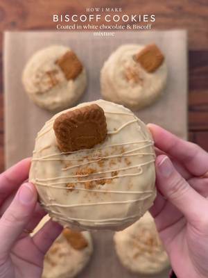 A rich Biscoff-filled cookie, wrapped in smooth white chocolate and Biscoff for every bite to melt perfectly🤤 Yields: 7-8 Cookies  INGREDIENTS: •115g cold chopped unsalted butter •60g caster sugar •80g light brown sugar •100g Biscoff spread •1 whole egg + egg yolk  •¼ tsp salt •1 & ½ tsp baking powder •¼ tsp baking soda •½ tsp vanilla •250g - 260g plain flour FOR COATING: •250g white chocolate •1 tbsp biscoff spread INSTRUCTIONS: •Cut cling wrap into small squares. Scoop 1 tsp biscoff spread onto individual cling-wrap squares. Fold to seal and freeze until solid. (Repeat for however many stuffed cookies you plan to make.) •In a large mixing bowl, add the cubed butter and whisk until slightly creamy. Add the white sugar and light brown sugar, then whisk together until well combined and then add Biscoff spread and mix again. •Add egg + egg yolk. Whisk until fully incorporated. •Add the vanilla bean paste, baking powder, baking soda, and salt. Gently mix and then add flour and gently mix again until just combined, do not overmix. •Portion the dough into 70g balls. Press a frozen Biscoff spread piece into the centre of each dough ball, seal well, and roll into a smooth ball. •Place the cookie dough balls onto a tray and freeze for at least 1 hour (or overnight for best results). •Preheat (fan) oven to 175-180C (350°F). Bake for 10-15 minutes or until the tops are lightly golden while the centres remain soft. •Remove from the oven and let cool completely. •Melt the white chocolate with Biscoff spread using double broiler method •Spread a layer of melted white chocolate biscoff mixture onto baking paper, just enough to coat the base of the cookie. Gently place the cooled cookie on top, then spoon more of the mixture over it, making sure the cookie is fully covered and evenly coated. Decorate the cookies by inserting half biscoff biscuit and drizzle the same mixture on them. •Let the white chocolate biscoff mixture set completely before serving, Enjoy!  NOTE: Store any extra dough balls in an airtight container or freezer bag and freeze for later. Whenever a cookie craving hits, bake straight from frozen🫶🏻 #cookie #biscoff #fyp #explorepage✨ #dessert 