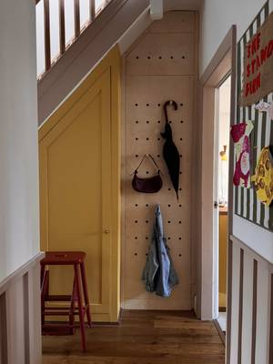 AD. Turning an awkward hallway corner into something that’s pretty and practical. Inspired by @interiordesignmasters (currently showing  on bbc) , I wanted to create something multifunctional so l hacked kitchen cabinets into a hidden cupboard that doubles as a pegboard.  Now it stores all the everyday hallway bits... and secretly hides our cleaning stuff too. What do you think? Materials: • Flat-pack kitchen cabinet (60 x 200cm) with legs  • flat pack kitchen Wall cabinet (60 x 60) • birch Plywood boards x2 • Drill + sander #pegboard #diypegboard #smallspacesolutions #storagehack 