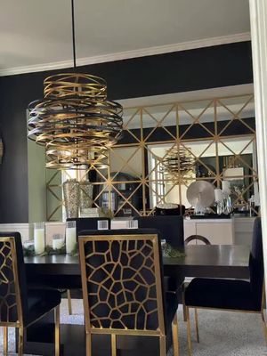 I think I’ve officially outgrown this dining room… and I need help deciding what direction to take it. The chandelier is staying because I still love her, but the rest of the room? I’m torn. I mocked up a few ideas to make the space feel more timeless, modern, and less glam. Option 1: Remove the mirror wall completely & add a picture Option 2: Reframe the mirror wall to feel more architectural Option 3: New chairs + a softer, more modern vibe Which one would you choose? Because I’ve stared at these renders way too long at this point. #DiningRoomDesign #ModernClassic #InteriorDesignIdeas #DiningRoomDecor #HomeRefresh