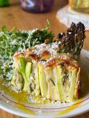 If quiche and spanakopita had a springtime love child, this would be it. This asparagus filo rose quiche is somewhere between a savory pie and a baked pasta rose. No cooking the asparagus, no dough making, just assembling everything and letting the oven do its thing.  The filo gets perfectly crispy on the outside, the center stays creamy, and I used my go-to @Organic Valley butter, cheddar, eggs, and cream because recipes like this really depend on good ingredients doing their thing. Serve it with a big lemony arugula salad and try not to eat half the pan standing over the counter before everyone even sits down. Couldn’t be me. YASSS! Ingredients-  For the filo rolls: 12 filo sheets 40-50 asparagus, peeled 2/3 from the bottom 1 leek, thinly sliced 1 bunch of scallions, thinly sliced 113 gr raw sharp cheddar, grated 113 gr salted butter, melted For the batter: 350 gr heavy cream 50 gr yogurt 2 pasture raised eggs 2 tbsp flour 1 tbsp pecorino romano Salt and black pepper For serving: Pecorino romano EVOO Aurgula salad Method- 1. Preheat your oven to 420°F / 215°C. 2. Place 2 filo sheets on a cutting board and brush with melted butter. Arrange 1/3 of the asparagus, sprinkle 1/3 of the leeks and scallions, and grate 1/3 of the cheddar on top. Cover with 2 more filo sheets, brush with melted butter, and roll into a thick log. Repeat twice with the remaining ingredients. 3. For the batter, mix all ingredients in a bowl until combined. 4. Cut the rolls into 3–4 inch pieces and shape into roses. 5. Arrange the roses tightly in a 9-inch springform pan. 6. Slowly pour the batter over the roses. 7. Bake for 25–30 minutes. 8. Remove from the oven and let the quiche rest in the pan for 20 minutes before cutting and serving.