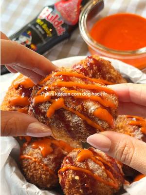 mini korean corn dog hack~ 🌭🧀 for this hack, use store bought crescent dough to make the easiest mini korean corn dogs at home ✨ you’ll need: -chunks of mozzarella cheese -mini sausages -crescent dough -2 eggs, beaten -panko breadcrumbs -frying oil toppings: -samyang @buldak global original hot sauce -mayo -sugar optional: make a buldak spicy mayo by mixing together mayo + samyang buldak original hot sauce 🌶️ directions:  1.wrap a piece of crescent dough tightly around your mozzarella or sausage + cheese combo, making sure there are no openings so the cheese doesn’t leak out while frying. 2.coat in egg wash, then cover in panko breadcrumbs. 3.deep fry over medium low heat for a few minutes (about 6-7 mins) until golden brown and crispy. keep the heat lower so the crescent dough has enough time to fully cook while the cheese gets melty 🫶🏼 4.finish with samyang buldak original hot sauce, spicy buldak mayo, and a sprinkle of sugar for that classic korean corn dog combo ✨ #BuldakApproved #BuldakOriginal #koreanfood 