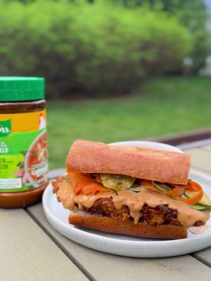 The flavor of @donaldo_cooks' Thai Peanut Chicken Sandwich called and we answered 📞 We just had to try his crispy, spicy, and juicy recipe, enhanced with savory flavor from our Chicken Bouillon 🐔🥜 Ingredients 2 boneless chicken thighs 1 tbsp Knorr Chicken Bouillon ½ c flour 2 eggs, beaten 1½ c crushed cornflakes 1/3 c smooth peanut butter 3 tbsp sriracha, divided ½ tsp crushed red pepper 2 tbsp soy sauce, divided 1 tsp molasses 1 c sliced cucumbers ½ c shredded carrots 1 tbsp red wine vinegar 1 tbsp avocado oil ½ tsp garlic powder ½ tsp onion powder ½ tsp ginger powder 1tsp honey black pepper ciabatta baguette Instructions 1. Season chicken with Chicken Bouillon. Dredge in flour, dip in egg, then press firmly into crushed cornflakes. 2. Spray both sides of chicken with oil. Air fry at 385°F for 16 minutes, flipping halfway. 3. In a bowl, mix peanut butter, 1-2 tbsp sriracha, crushed red pepper, 1 tbsp soy sauce, and molasses. Add 2-4 tbsp water gradually until smooth and pourable. 4. Combine cucumbers, carrots, red wine vinegar, avocado oil, garlic powder, onion powder, 1 tbsp soy sauce, ginger powder, black pepper, honey and 1 tbsp sriracha. Toss well. 5. Once chicken is done, toss or brush generously with the peanut sauce. 6. Toast baguette. Add sauced chicken, top with cucumber carrot salad, and finish with extra sauce, if desired. #Knorr #sandwichlover #sandwichrecipe #thaicuisine #chickensandwich