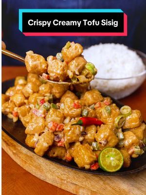 THE SECRET TO A CREAMY & EXTRA CRISPY TOFU SISIG 🔥 Ingredients: 400g Firm Tofu, cut into 1.5cm cubes 1 cup Cornstarch Neutral oil for deep-frying Dressing ¼ cup Lady’s Choice Real Mayonnaise 3 tbsp oyster Sauce ½ tsp liquid seasoning 1 tbsp margarine 2 tbsp Red onion minced 2 tbsp White onion, minced 2 tbsp Red bell pepper, diced 2 tbsp Green bell pepper, diced 1 tbsp Green finger chilies (siling haba), sliced ½ tsp Red bird’s eye chili (siling labuyo), sliced Garnish Fresh calamansi halves 1 pc. whole red chili @Lady’s Choice Philippines  #MakeUlamMayomazing #LadysChoice #food #foodlovers #lumpiaqueen