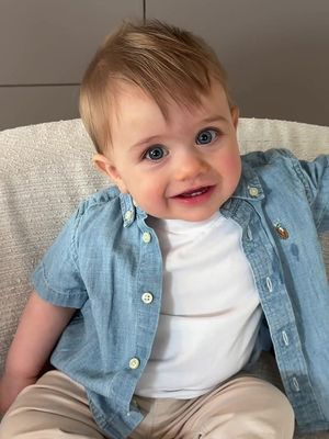 My whole world wrapped in tiny smiles 🌍