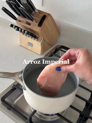 Arroz Imperial Recipe 🇨🇺⬇️ 2 cups white rice 3 cups water 1 packet Goya Sazón 3 chicken breasts 1 onion 1 red pepper 1 green pepper Garlic cloves Oregano  Cumin  Adobo seasoning Bay leaf Salt & pepper to taste ¼ cup white wine 1 can tomato sauce  Mayonnaise Mozzarella cheese, shredded Boil the chicken breasts in salted water for 20–25 minutes until fully cooked. Shred and set aside. Cook the rice with 3 cups of water, Sazón, and salt. In a large pan with olive oil, sauté onion, red pepper, green pepper, and garlic until soft. Add oregano, cumin, adobo, bay leaf, salt, and pepper. Pour in white wine and simmer for 2–3 minutes. Add tomato sauce and shredded chicken, then simmer.  Preheat oven to 350°F. In a baking dish, layer rice, a thin layer of mayo, and the chicken. Repeat layers and top with mozzarella cheese. Bake uncovered for 20–25 minutes. Broil for 2–3 minutes for a golden top. #cuban #arrozimperial #cubanfood #latinacontentcreator #comidacubana 