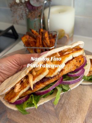 NANDO’S STYLE FINO CHICKEN PITTA We love a Nandos, but you really can make it just as delicious at home & include all the bits and extras you like!  Follow @kimberlys_journeyy for more recipes like this⤵️ Serves: 2 For the chicken: * 200g chicken breasts (butterflied or sliced thin) * 2 tbsp peri peri marinade * 1 tbsp chicken seasoning * 2 tbsp peri peri sauce For the pittas: * 2 soft pittas * 100g reduced fat halloumi To assemble: * 30g perinaise * 30g caramelised onion chutney  * Lettuce (shredded) * Red onion (thinly sliced) METHOD: Butterfly or thinly slice the chicken so it cooks quickly and evenly. Coat in the peri peri marinade and seasonings, then pan fry this for 3-4 minutes each side. Finish the chicken in the air fryer or oven for 5–8 minutes until cooked through. Cook the halloumi in a pan or under the grill until golden on both sides. Warm the pittas and lightly spread with garlic butter, then toast until soft and slightly crisp on the edges. To assemble, open the pittas and spread the caramelised onion chutney inside. Add shredded lettuce and red onion, then layer in the peri peri chicken and halloumi. Add and finish with the perinaise. Close, press gently and serve warm. #nandosfinopitta #nandosfakeaway #fakeaway #EasyRecipes #DinnerIdeas 
