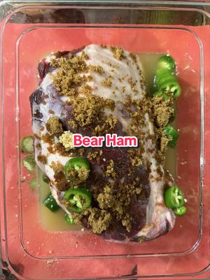 My friend @jennrivet_ showed us how to cook bear on the @traegergrills and made us a delicious dinner at bear camp! Ingredients for 48 hour marinade for “Jenn’s Smoked Bear Ham.” All amounts are approximate and up to your taste and size of the ham.  • Enough Pineapple Juice & water (3:1 or so) to cover the ham • 1/2 C vinegar  • 2-3 Jalapeños, sliced  • 4 T Minced Garlic • 2 T whole peppercorns  • 1 Cup Brown sugar • Meat Church Holy Voodoo to taste I’m very excited to be bringing Bear meat back to Texas to put this on our YouTube channel coming soon! #MeatChurch #BBQ #Bear #Hunting 