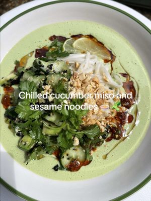 SUPER EASY creamy cucumber, miso and sesame chilled noodles 🥒✨ These noodles are everything you could want from a dish...they take about 10 minutes to throw together, they're creamy, slightly nutty from the sesame and refreshing from the cucumber. Then wallop, you get hit with tang from lime and umami from miso. It really is a winner, and requires basically no cooking (aside from a quick noodle boil). This will rescue you on many balmy evenings this summer... and even in this weird limbo where it's neither hot nor cold 🤝 RECIPE for 2-3 Sauce/soup: 115g cucumber, seeds removed 2.5 tsp sesame oil 1.5 tbsp white miso paste® 2 spring onions, green tops only 1 small garlic clove 1 block silken tofu 10g ginger, peeled 1 lime, juice ¼ tsp sugar 15g fresh coriander ½ lime zest (optional) green chilli, to taste Salt to taste Cucumber salad: Rest of the cucumber + salt ½ avocado, diced ½ sheet toasted nori, rolled and sliced into thin strips 1/2 top toasted white sesame seeds 1/2 tbsp toasted black sesame seeds A handful fresh coriander leaves, roughly torn or chopped Squeeze of lime To serve: 2 servings noodles of choice 35g peanuts, finely chopped Chilli oil and/or sesame oil Wedge of lime 1. Blend all of the ingredients for the sauce until completely smooth 2. Bash the rest of the cucumber with a rolling pin or something heavy. Cut the smashed cucumber up into bitesize pieces then place into a bowl with a pinch of salt. Leave to sit for around 5 minutes, whilst you cook the noodles. 3. Drain the cucumber then add the rest of the salad ingredients to the bowl and season to taste. 4. Rinse the cooked noodles under cold water to stop cooking then add to 2 bowls. Pour the soup/sauce around the noodles then top with the cucumber salad, peanuts and chilli/sesame oil. Squeeze over a wedge of lime and enjoy!