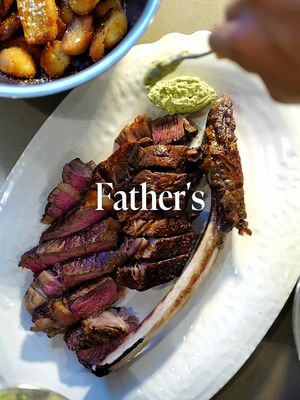 AD | Father’s Day with @waitrose The best table on Father’s Day is not always in a restaurant. Sometimes it is the one at home: British beef tomahawk steak, crisp potatoes, anchovy and herb butter, and a sharp gremolata for the last few bites. For this, I wanted to keep the cooking simple but generous. The kind of meal that gives people something to carve, something to pass around, and a reason to stay at the table a little longer than they meant to. #HomeOfFoodLovers #homecooking #steak #dads #FathersDay 