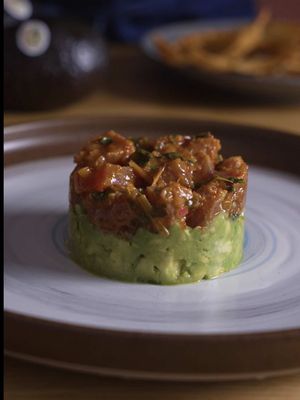 When you’re making fresh tuna tartare, quality matters. Since June is California Avocado Month, a time when this delicious locally grown fruit is at its peak, I made sure to include @California Avocados — locally grown, in season right now through summer, creamy, rich and the perfect base for this bright, spicy bite. #AD    Ingredients For the Tuna Tartare 1 ½ lb fresh sushi-grade ahi tuna, diced into 1-inch cubes 2 tbsp Thai fish sauce ⅓ cup fresh lime juice (about 2–3 limes) 2 tsp tamarind concentrate 2 tbsp finely minced lemongrass ½ tbsp ground toasted rice powder 1 tsp ground/chopped Thai chili pepper  1 tbsp coconut sugar 1 tbsp finely chopped cilantro 3 tbsp chopped green onion For the California Avocado Base 3 ripe, Fresh California Avocados, seeded, peeled and diced Zest and juice of 2 limes ½ tbsp sesame oil Pinch of salt Tortilla chips, wonton chips, or your favorite crispy chips Instructions 1.Using a very sharp knife, dice the sushi-grade tuna into uniform 1-inch cubes. Try not to cut the pieces too small so the tuna keeps its texture and doesn’t cure too quickly in the marinade. Keep chilled while preparing the sauce. 2.In a mixing bowl, combine fish sauce, lime juice, tamarind concentrate, lemongrass, rice powder, Thai chili, coconut sugar, cilantro and green onion. Mix well until the sugar dissolves. Taste and adjust as needed add more lime juice for brightness, a splash of water if too intense, or more chili for heat. Add the diced tuna to the bowl and gently fold everything together until evenly coated. Place in the fridge while preparing the avocado base. 3.Make the California Avocado Base In a separate bowl, combine California avocado, lime zest and juice, scallions, oil and pinch of salt. Gently mix together, keeping the avocado slightly chunky for texture. 4.Lightly oil the inside of a mold, or ramekin.  5.Start with a layer of the avocado mixture on the bottom and gently press down. Add the marinated tuna on top and press lightly to hold its shape. Carefully remove the mold to reveal the tartare stack. 6.Finish with extra scallions, cilantro, or chili if desired and serve immediately with crispy chips on the side. Perfect for a hot summer day.