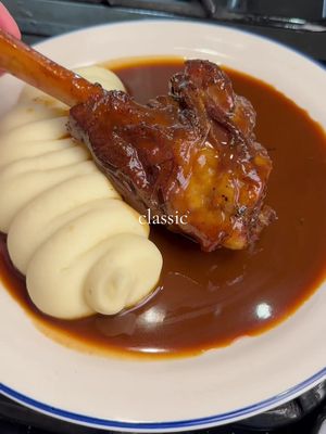 LAMB SHANKS // RED WINE SAUCE 🍷 Lamb shanks are a decadent cut that transform into tender, fall-off-the-bone perfection when slow-cooked. My take on this classic features lamb shanks braised in a rich red wine sauce, paired with a vibrant homemade mint sauce.  Lamb shanks: Season 3 lamb shanks and sear in a  Casserole Pot until browned. Set aside. Caramelise 3 halved shallots, remove, then sauté 2 diced carrots, 1 diced onion, 2 diced celery stalks, and 2 tbsp tomato paste. Deglaze with 500ml red wine, add 500ml chicken stock, garlic bulb, herbs, and peppercorns. Return shanks, cover, and cook in the oven at 140°C for 3.5 hrs. Uncover and cook for 45 mins. Strain the liquid, reduce to a silky sauce, stir in 50g butter, and season. Baste the shanks in sauce. Mint sauce: Steep 30g chopped mint in boiling water for 3 mins, refresh in cold water, and drain (reserve 1 tbsp liquid). Mix 1 tbsp liquid, 2 tbsp cider vinegar, 2 tsp sugar, and a pinch of salt. Add mint and let sit for 30 mins. Serve the shank with the sauce and mint sauce, and enjoy with your favourite mashed potatoes! #food #cooking #lamb #meats #tender