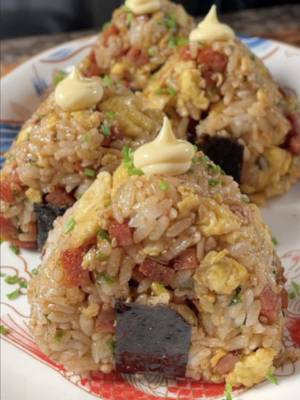 The perfect picnic food!  🍙 by @Sarah  Ingredients: -1 cup rice, cooked -½ can Spam, cubed -1 Tbsp soy sauce -1 Tbsp sugar -2 Tbsp bbq sauce -3 eggs -spray oil -4 Tbsp furikake Garnish: -chives -kewpie mayo -seaweed strips Steps: 1. Cook rice according to package instructions and set aside to cool. 2. Cube spam into small bites, set aside. 3. In a large pan on medium heat, spray with cooking oil before adding spam. Toast on all sides until slightly brown, about 3 minutes. 4. Add in the soy sauce, sugar, and bbq sauce, and cook for another 3 minutes or until the sauce thickens to liking. Remove and set aside. 5. In a bowl, mix your eggs to scramble. 6. In the same pan over medium heat, spray with cooking oil and scramble the eggs until set, about 1 minute. Set aside. 7. In a large mixing bowl, combine cooled cooked rice with spam, scrambled egg, and furikake. 8. Mix well and form into round balls. 9. Wrap the rice balls with the seaweed strips and top with kewpie and chives. 10. Enjoy immediately!