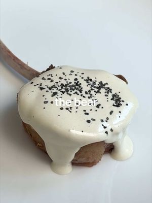 How to Make Lamb w/ Tonnato 🐑🐟 (From the Bear)  FULL RECIPE BELOW ⬇️  INGREDIENTS: 1 x 1/2 lamb rack (7 bones) 4 tbsp cold butter, diced 2-3 sprigs each thyme + rosemary 1 x 80g can tuna in olive oil 5 anchovies in oil 1 lemon 2 tsp capers 1 tsp Dijon 2 egg yolks 1 + 3 cloves garlic  1/4 cup cold water 500mL olive oil Salt & black pepper to taste INSTRUCTIONS: 1. Ideally 24 hours before cooking, dry out your rack of lamb in the fridge on a wire rack. I "frenched" my lamb rack myself (i.e. I cleaned the meat off the bones for presentation), but most butchers/supermarkets sell their lamb racks already frenched. I recommend buying your lamb already frenched, because it will save you time + yield a better result!  2. For your tonnato sauce, add your canned tuna, anchovies, capers, garlic, water, Dijon & egg yolks to a blender along with the juice from your lemon. Blend your tonnato "base" until smooth, then slowly start adding your olive oil into the blender, bit by bit, until your sauce has thickened. You want your tonnato to be the consistency of a very thick sauce, but not as thick as a store-bought mayo. You’re looking for a nice middle ground (see video for reference). Alternatively - you can replace the egg yolks, water & olive oil with 500mL good quality mayonnaise. It will yield the same result! Your tonnato will also be more stable. NOTE: This recipe will yield more tonnato sauce than is needed for this quantity of lamb. You can save the extra sauce to use as a dip or salad dressing. ALSO: I recommend serving this tonnato sauce at room temperature so it doesn’t cool down your lamb when cooked. Take the quantity needed out of the fridge 1hr before serving your lamb.  3. For your lamb, take the rack out of the fridge 1 hr before cooking. This will ensure it cooks quickly & evenly. Season your lamb generously with salt.  4. Start a large heavy-bottom pan over medium-high heat with 1 tbsp neutral oil. Add the lamb to the pan while the pan is still cold with the fat cap side down. While the pan heats up, the fat will render more evenly. Once the pan is hot, and the fat has started to render, sear the lamb all around to develop a crust. Once the lamb is nicely browned all around, turn the heat on your pan down to low. Add your butter, thyme, rosemary & 3 cloves of garlic. Baste your lamb chops in the foaming butter, turning/flipping your rack every 2 minutes or so. Continue cooking your lamb rack like this, developing even colour, until the internal temperature at the thickest point reaches 45 degrees Celsius. If your butter starts to blacken/burn during this process, dump out the butter and add more as needed.  5. Once your lamb rack is done, remove it from the pan and transfer it to a tray lined with a wire rack to rest. Allow the lamb to rest for at least 10 minutes before slicing. When ready to serve, slice your lamb rack between each bone & serve each slice with a generous spoonful of your tonnato sauce. Enjoy! #lamb #tonnato #thebear #homecooking #Recipe 