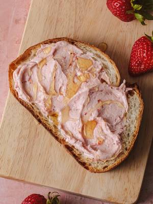 Save this strawberry butter recipe for summer 🍓  RECIPE 2 cups heavy cream 8 ounce strawberries, hulled and quartered 2 tablespoons honey ¼ teaspoon salt, or to taste   In a stand mixer, whip the cream on high speed until the butter solids separate from the liquid buttermilk, 10 to 15 minutes.   Meanwhile, cook the strawberries and honey together in a saucepan over medium heat until soft and jammy. Puree with an immersion blender, food processor, or crush the fruit with the back of a fork. Set aside.   Once the butter separates, stop the mixer and squeeze out as much of the liquid as possible using your hands or a cheesecloth. Rinse the butter in a bowl of ice water. Squeeze again to release more liquid and shape into a disk.   Sprinkle the salt on the butter and fold. Place it back in the mixing bowl. Add 3 to 4 tablespoons of the strawberry sauce and whip together until smooth and combined. Spread on your favorite baked goods and treats. Store leftovers in an airtight container in the refrigerator for up to 5 days.
