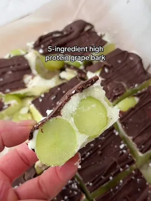 high-protein and a crunch? this grape bark is a fun winter snack you won't want to miss 🍇 YoPRO 150g pouches are now on sale at Coles, dropping from $3.20 to $2.50* ingredients: 2 cups grapes 2 x 160g Vanilla YoPRO pots 1/4 cup sugar-free chocolate chips 1 tbsp coconut oil flaky sea salt, to top method: 1. in a large bowl, combine the grapes and Vanilla YoPRO 2. transfer onto baking paper 3. melt the chocolate and coconut oil in the microwave, stirring every 30 seconds until completely melted 4. pour over the yoghurt-covered grapes 5. top with flaky sea salt and freeze for a few hours or overnight 6. slice and enjoy! *Disclaimer: Offer available at Coles (in-store and online) from 08/07/2026 to 14/07/2026. Stock availability may vary per store. #YoPRO #HighProtein #GrapeBark #SnackTok #EasyRecipes