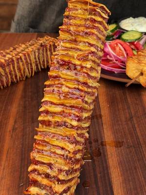 🔥 Tortilla Kebabs with Garlic Butter & Tzatziki A fun twist on classic kebabs. Crispy tortillas, smoky seasoned beef, garlicky butter, cool tzatziki, and a fresh tomato-cucumber salad—this one's guaranteed to impress. Ingredients • 1½ lb ground beef (80/20) • 6 flour tortillas • 1 tsp each: kosher salt, black pepper, cumin, garlic powder, smoked paprika • ½ tsp dried oregano • ½ grated yellow onion • 3 cloves garlic, minced Garlic Butter • 4 tbsp melted butter • 2 cloves garlic, minced • Pinch of salt Tzatziki • 1 cup Greek yogurt • 1 Persian cucumber, grated & drained • 1 garlic clove, minced • 2 tbsp chopped dill • 1 tbsp lemon juice • ½ tsp salt Tomato-Cucumber Salad • Roma tomatoes • Persian cucumber • Red onion • Parsley, mint & dill • Red wine vinegar • Olive oil • Salt & pepper Method 1️⃣ Preheat your Traeger to 450°F with Hickory pellets. 2️⃣ Mix the beef with the seasonings, grated onion, and garlic. 3️⃣ Trim tortillas into squares. Spread each with a thin layer of beef, stack them, then cut into 9 rectangles. Skewer through the layers. 4️⃣ Grill for 10–12 minutes, flipping once and brushing with garlic butter halfway through. 5️⃣ While the kebabs cook, stir together the tzatziki and toss the tomato-cucumber salad. 6️⃣ Brush the finished kebabs with more garlic butter and serve alongside the tzatziki and salad. Smoky, crispy, buttery, and packed with fresh flavor—these kebabs are about to become a new backyard favorite. #Traeger #TraegerGrills #TraegerRecipes #Traegerhood #Kebabs #WeeknightDinner #WoodFiredFlavor #BBQ #Grilling