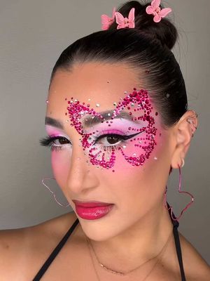 Butterfly Kisses 🦋💖✨ When I saw this butterfly makeup look @Sophia Sinot look she created on @Zara Larsson I knew I had to recreate it! It was SCREAMING my nameI bet y’all didn’t know I could still get down like this. Obsessed with look ✨ PRODUCT DETAILS 👉🏼 FACE 🦋 @elfcosmetics Thirst Burst Drops 💖 @DanessaMyricksBeauty Yummy Skin Blurring Balm Powder  ✨ @L’Oréal Paris Infallible Cushion Foundation 🦋 @Charlotte Tilbury Airbrush Flawless Blur Concealer & 💖 @Too Faced Melting Bronzing & Sculpting Stick  ✨ @Beauty Creations Cosmetics Liquid Blush (Pink Thing)  🦋 @Morphe Cosmetics Cheek Thrills Bronze & Tone Duo  💖 @KimChi Chic Beauty  Puff Puff Pass Loose Setting Powder *USE CODE “LEXILALAMAKEUP15” FOR 💰 OFF* ✨ @SHEGLAM Insta-Ready Loose Setting Powder (Taro) 🦋 @MCoBeauty Miracle Flawless Pressed Powder  💖 @Juvia’s Place Blushed & Bronzed Blurring Pro Palette (Vol 2)  ✨ @M·A·C Cosmetics Skinfinish Sunstruck Matte Bronzer Powder BROWS 🦋 @Rare Beauty Brow Harmony Brow Gel  💖 @Dominique Cosmetics  Brow Frame EYES 🦋 @kimchichic Holy Sharts & Holy Fairytale Eyeshadow Palettes *USE CODE “LEXILALAMAKEUP15” FOR 💰 OFF* 💖 @Glisten Cosmetics LTD Bliss Palette  ✨ @Trixie Cosmetics Play Pigment Matte Liquid Pigment (Player One)  🦋 @Makeup A Murder, INC. Liquid Eyeshadow (Sew Me Up)  💖 @EXO Cosmetics Just The Tip Liquid Eyeliner  ✨ @rudecosmetics Super Fantastic Multipurpose Makeup Pencil (SuperWhite) 🦋 @Lilly Lashes 3D Faux Mink Lashes (Paris)  💖 @JELLIWINK COSMETICS Graphic Paint Pot (Whimsey) - Used to draw the butterfly outline  GLITTER/SPARKlE  ✨ @Sheglam_official Go Go Glow Highlighting Body Mist (Love Bomb) 🦋 @jelliwinkcosmetics Loose Chameleon Pigments (Snow, Rouge, Ultraviolet  LIPS  🦋 @Point of View Beauty Contour It Lip Pencil (Bon Bon)  💖 @ColourPop Cosmetics Hyper Shine Glossy Lipstick (Pink it Over) Makeup, Makeup trends, Creative makeup, Pink, Butterfly makeup, Makeup inspo, Zara Larsson, Rhinestone makeup 