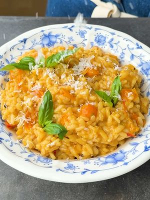 Sungold Risotto is far better than Spring Pea Risotto, in my opinion. - 1/4 cup extra virgin olive oil 1 small shallot, finely chopped 2 garlic cloves, thinly sliced 2 cups Sungold tomatoes 1/2 cup dry white wine 1 1/2 cups Arborio rice 4 cups warm stock (I used vegetable) 1 cup grated Parmigiano-Reggiano, plus more for garnish 1/2 cup mascarpone 2 tablespoons butter Kosher salt and black pepper, to taste Fresh basil, for garnish #risotto #sungoldtomatoes #Recipe #tomatoes 