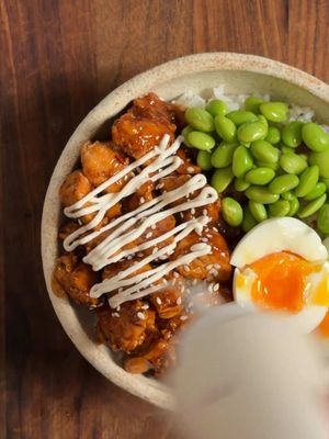 Teriyaki Chicken Bowl with a creamy high-protein YoPRO drizzle you'll want on everything | @ali  Chicken Marinade 500g chicken breast, cut into bite-sized chunks 160g YoPRO Plain yoghurt 1 tbsp tamari (or soy sauce) 1 garlic clove, grated 1 tsp fresh ginger, grated Teriyaki Glaze 7 tbsp tamari (or soy sauce) 3 tbsp honey 2½ tbsp rice vinegar 3 garlic cloves, grated 1½ tbsp fresh ginger, grated ¾ cup water 1 tbsp cornflour Creamy YoPRO Drizzle 320g YoPRO Plain yoghurt (160g per serve) 4 tbsp milk, to loosen 1 lime, juiced 2 tsp tamari (or soy sauce) ½ tsp garlic powder Pinch of chilli flakes (optional) To Serve: 2 spring onions, or chives White sesame seeds 1½ cups cooked rice 120g edamame Method: 1. Coat the chicken in the marinade ingredients. Rest 30 mins, then scrape off the excess. 2. Whisk all glaze ingredients. 3. Warm the rice. Blanch the edamame. Slice the garnishes. 4. Heat avocado oil over medium-high. Sear the chicken in two batches until golden. 5. Return all the chicken to the pan, pour in the teriyaki and simmer and toss 2 to 3 mins until thick and glossy. 6. Stir the milk into the YoPRO Plain yoghurt and then mix in the lime, tamari, garlic powder. Pour into a squeeze bottle. 7. To the bowl: rice, then chicken one side, edamame the other, and garnish of your choice. Pour the YoPRO yoghurt drizzle over and enjoy. #YoPRO #DinnerTok #HighProteinMeals #TeriyakiChicken #EasyDinnerIdeas