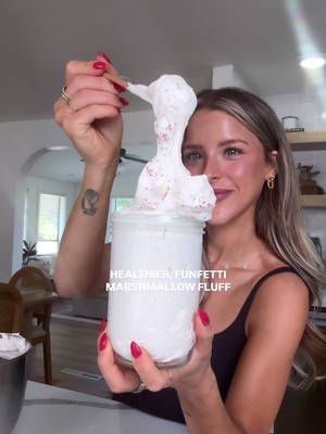 This healthier homemade marshmallow fluff is actual heavennnn and so easy to make! This is my funfetti version, but I have SO many different flavors on my blog (just search “fluff” in the search bar — linked in my bio!)  Use it as a healthy frosting, on pancakes or waffles, or even in cold foam for lattes! #marshmallowfluff #homemademarshmallows #healthydessert #healthyrecipes #viral 