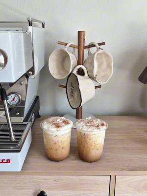 Two homemade lattes to go > coffee shop.🤎 ✨Recipe✨ - 1-2 tsp maple syrup  - pinch of salt  - double shot of espresso  - tons of ice  - milk of choice  - vanilla cold foam ( optional )  - finish with a dash of cinnamon  Enjoy⭐️ #homebarista #espresso #coffee #coffeelover #fyp 