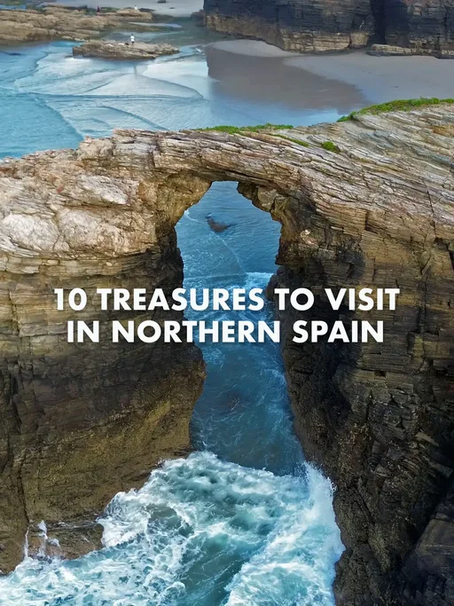 Northern Spain is full of treasures: here are 10 to visit in the beautiful and historic region of Galicia. Playa de las Catedrales This natural wonder reveals itself at low tide when the waves retreat and the beach is uncovered. Known for huge arches and caves formed by wind and sea erosion. At high tide you can admire it from the tops of the giant cliffs above, but it’s best to go at low tide when you can walk down and explore on foot. Isla Pancha  Isla Pancha is home to two distinct lighthouses. It’s only two kilometres from the town centre of Ribadeo but feels a world away. The square lighthouse was built in 1857 and cast a guiding light until 1983 when the taller lighthouse was constructed. If you’d like to linger longer, you can even stay overnight: the historic square lighthouse now provides guest accommodation. Monastery of Santa María in Sobrado dos Monxes This monastery has been welcoming Camino pilgrims since the 10th century. During the Spanish Confiscation, the church here was stripped bare and abandoned. The walls are now covered in green moss, as though nature has reclaimed it as its own sanctuary.  Castro de Santa Trega  Monte Santa Trega is home to a fascinating archeological discovery: a Celtic fort and village dating back to at least the 4th century. In its heyday, around 5000 people called this home. The entire site was discovered accidentally in 1913 while building a mountain road. City of Culture  This extraordinary design complex is a library and archive, an art gallery, office space for entrepreneurs, concert venue, and more. The undulating shape is meant to imitate the curves and lines of a shell, which is the symbol of the Camino pilgrimage. Monastery of San Salvador in Vilanova de Lourenzá This Benedictine monastery was founded in the 10th century. It’s an important stop for pilgrims on the Northern Way, one of the official Camino routes. One of the treasures inside the monastery is an ornate 17th century reliquary containing 28 relics. The founder of the monastery is also buried here in a 5th century marble sarcophagus. Camino pilgrims have come here since he died in the 10th century. Pazo de Castrelos This 17th century Galician manor houses Museo Quiñones de León in Pazo de Castrelos. Construction began in 1670 and the French-style gardens include 19th century ponds and fountains. The sun-dappled gardens feature orange trees, a miniature manor house sitting placidly in the middle of a pond, and chirping frogs. Rinlo A quiet coastal fishing village near Playa de las Catedrales. With its cobblestone streets and brightly-coloured houses, Rinlo keeps its old world charm.  Castelo do Castro, Vigo  Monte do Castro is where you find a 17th century fortress, Celtic ruins dating back to 300 BC, and panoramic views the Vigo estuary. The Bay of Vigo is featured in the book 20,000 Leagues Under The Sea and there is a statue of Jules Verne nearby. Today, Vigo is one of the world’s largest fishing ports and unloads about 34,000 tonnes of fresh fish each day. It’s called “the fridge of Europe” because of all the seafood it supplies to the continent. Cathedral of Santiago de Compostela  All routes of the Camino end here at the cathedral: the sight Camino pilgrims wait to see every step of their journey. Camino pilgrims arrive to the front of the cathedral in Plaza de Obradoiro and it’s an emotional moment. Roof of the Cathedral of Santiago de Compostela  You can climb 140 steps to the top of the cathedral and tour the rooftop. You get an unbeatable view of Plaza de Obradoiro below, full of Camino pilgrims. Alameda Park  Alameda Park offers one of the best views of the cathedral. Framed by leafy green trees, and lots of places to sit down and rest, you can see the cathedral from afar and enjoy the quiet shade of the park. Which of these places would you most like to visit? Save this for later and send it to the person you want to visit northern Spain with. #spain #spaintravel #galicia #caminodesantiago #españa @visitSpain @Turismo de Galicia