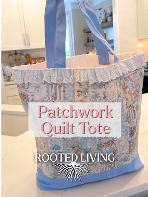 DIY Faux Patchwork Quilted Tote Bag — all supplies are linked in my bio.  Who says patchwork has to involve sewing?  This faux patchwork quilt tote came together with nothing more than a bit of fabric and Fabric Mod Podge! I cut fabric into squares, adhered them to both sides of a plain tote, sealed everything with another coat of Fabric Mod Podge, let it dry, then finished it off with faux white fabric puffy paint stitched details and eyelet lace trim. No sewing machine. No needle and thread. And an easy way to give fabric scraps a second life! Use it as a farmers market bag, beach bag, picnic tote, travel bag, diaper bag… or, in my case, it’ll probably be heading to craft night with friends.  Follow for more thrift flips, budget-friendly DIY home decor, creative home decorating ideas, vintage-inspired decor, textured wall art, gallery wall inspiration, air dry clay DIYs, Rub ’n Buff projects, mod podge, frame makeovers, and step-by-step craft tutorials. #fyp #DIY #quilt #tote #upcycle 