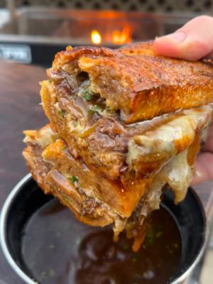 Viral @salt_hank French Dip at Home Recipe 👇 Recipe: Servings: 4 People Prep: 30 minutes Cook: 3 hours Beef: 1 Beef Chuck Roast 3 cups Beef Stock 1 cup Red Wine 1 cup SPG ½ cup Sliced Onions 3-4 Garlic Cloves, smashed 2-3 Rosemary Sprigs 3-4 Thyme Sprigs Sandwich: 2-3 French Baugettes 9-10 Provolone Slices Horseradish Mayo: 1.5 cups Mayonnaise 2 tbsp Prepared Horseradish 1 tbsp Chopped Chives 1 tsp Worcestershire Sauce Caramelized Onions: 2 medium White Onions, thinly sliced 2 oz Favorite Whiskey Salt & Pepper to taste 2 tbsp of Canola Oil Instructions: Onions: Preheat your grill to medium high heat (about 350F) for direct cooking. Add a cast iron skillet to the grill 2 minutes before cooking. Add oil in the skillet and add your thinly sliced white onions. Season the onions with salt and pepper and begin cooking on a medium heat until they are caramelized (dark brown). This should take about 45-60 minutes to achieve. Stir frequently and move from high heat to prevent them from burning. Once they are dark brown and soft, add your garlic to cook for 2 more minutes. Finally, deglaze the skillet with whisky if you like, then let simmer until most of the liquid is gone (about 2-3 minutes). When the onions are done, pull off and keep warm. Beef: Preheat your fire to medium high temperature (around 375F). Add to your grill grate 2-3 minutes before cooking over the flames. Slather your beef with oil and liberally season with salt, pepper and garlic powder. Place the beef on the grill and sear off all sides until browned on all sides. Pull the beef off and place down your dutch oven. Add some oil and brown your garlic (about 2 minutes). Next, add your sliced onions and brown as well (another 2 minutes). Finally, add the rosemary, thyme and red wine. Add your beef back to the dutch oven and fill with beef broth so that the beef is almost submerged in the broth. Cover the dutch oven and let simmer over medium high heat until the beef is fork tender (about 3.5-4.5 hours). Make sure to skim the top of the sauce of fat as needed. Once the beef is tender, pull it out. Next, dispose of the bones, bay leaves and thyme springs. Strain your braising sauce from the meat until it is a clean au jus for dipping. In a bowl, mix together all the ingredients for the horseradish sauce. Slice your bread in half and add some horseradish sauce to the inside. Shred the beef and add to the bread with onions and cheese. Add this along with the top of the bread to an oven at 450F to melt the cheese. Serve with the au jus for dipping on the side and enjoy!