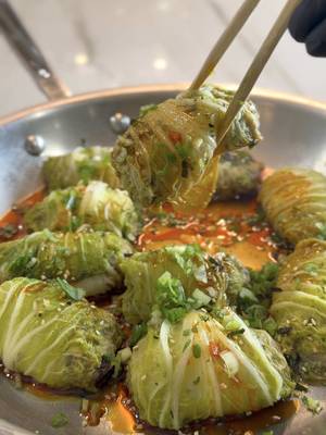 Everyone wants to lose weight until they find out it still takes effort in the kitchen. These cabbage dumplings make that part a whole lot easier. 🥟🥟🔥 Cabbage Dumplings Ingredients Ground chicken, 2 pounds Portabella mushrooms, finely diced, 8 ounces Scallions, finely sliced, 4 Soy sauce, 2 tablespoons Oyster sauce, 1 tablespoon Chicken bouillon powder, 1 teaspoon Salt and black pepper, to taste Small Napa cabbage, 1 to 2 heads Furikake, for garnish Chili oil, for serving Sliced scallions, for garnish Instructions Bring a large pot of water to a boil. Blanch the Napa cabbage leaves for 45 seconds to 1 minute, just until softened and flexible. Transfer to a towel and pat dry. In a large bowl, combine the ground chicken, mushrooms, scallions, soy sauce, oyster sauce, chicken bouillon, salt, and pepper. Mix until everything is well combined. Spoon the filling onto the base of each cabbage leaf. Fold in the sides and roll tightly to seal. Arrange the dumplings seam side down in a large skillet or steamer. Add 1/4 cup water to the pan, cover, and steam over medium heat for 12 to 15 minutes, or until the chicken reaches an internal temperature of 165 degrees. Remove the lid and let any remaining water evaporate for 1 to 2 minutes. Finish with furikake, a drizzle of chili oil, and sliced scallions before serving. #dumplings #cabbage #healthyeating #food #foodtiktok 