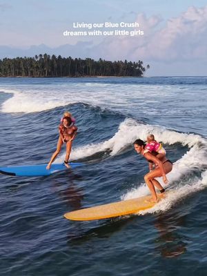 PARTY WAVE!! 🏄‍♀️🌸💦The way I dreamed about the Blue Crush life as a teenager growing up in the middle of the prairies of Saskatchewan would make you laugh. I went to school wearing a puka shell necklace, had fake waves painted in my room, and even a fake palm tree!  If you had told that teenage girl that one day I’d be riding waves with my own kids, I don’t think I would’ve believed you. Follow your dreams. Sometimes they unfold even more beautifully than you ever imagined. 🤍 This was such a memorable sunset surf with my sis @rocamoons and our babies! The girls giggling as we sang and danced on our boards, and cheered them on is a memory I wish I could bottle up forever. I’m so grateful we have these moments on video. 🥹 Thank you @kanduivillas and @iqbalmentawai !! #dreambig #surftrip #momlife #kanduivillas #family@IQBAL mentawai @Rocamoon 