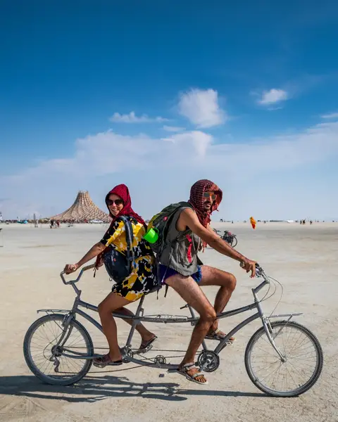 Organizing your trip to the dust? Just like planning your commute at home, it’s important to think ahead about reliable transportation in Black Rock City. Burning Man is a bike-oriented culture and Black Rock City is vast. Do not underestimate the importance of having a reliable, well-tuned bicycle on playa! Black Rock City's speed limit is 5 mph and it applies to ALL vehicles 👉 e-bikes too! Read more in the Survival Guide: https://survival.burningman.org/getting-around-brc/bicycles/ Here's what you need to know about biking in BRC: 💡 Light your bike. 🔒 Lock your bike. 🏷️ Label your bike. ❗ Take your bike with you when you leave. 🚲 Do not go faster than 5 mph! 1. 📸: Susan Becker 2. 📸: Manon Nyffeler 3. 📸: Tulio Vera 4. 📸: Henry Wu 5. 📸: Gurpreet Chawla