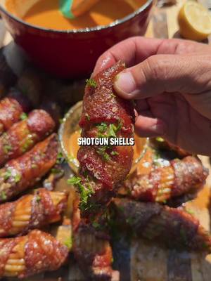 Cajun BBQ Shotgun Shells Recipe: -In a large bowl mix 2 lbs ground beef, 2 chopped onions, 6 cloves garlic minced, 2 tsp crushed red pepper, 4 tsp cajun seasoning, 2 tsp cumin, 1 tsp each of salt and pepper, and 2 cups shredded mozzarella cheese until well combined. -Stuff beef mixture into uncooked manicotti shells, then wrap with bacon and add more blackening seasoning. -Place the shells onto a tray and put in the fridge overnight to soften. -Cook the shells for 1 hour at 300F or until the internal temp reaches 165F. -While those cook make cajun butter by mixing 2 sticks of butter, 2 cloves minced garlic, 3 tsp cajun seasoning, 1 cup heavy whipping cream, and 1/2 lemon juiced. -Brush the butter sauce on the shells for the last few minutes of cooking. -Take off the grill, paint with more sauce, and enjoy. #bbq #shotgunshells #barbecue