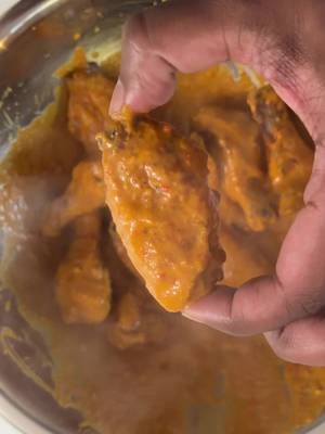 Buffalo Butter Chicken Wings Ingredients Wings 1kg chicken wings ½ tsp smoked paprika 1 tsp garam masala 1 tsp garlic powder 1 tsp Kashmiri chilli powder 2 tbsp baking powder Sauce 1 small shallot or onion, diced 4 chillies, chopped 3 garlic cloves, minced 1 thumb-sized piece ginger, grated 2 tbsp tomato paste 1 tsp cumin 1 tsp garam masala 1 tsp Kashmiri chilli powder ½ tsp turmeric ½ tsp smoked paprika 1 cup chicken stock 1 tbsp apple cider vinegar 1 tsp kasoori methi 2 slices Kraft Singles 20g butter Salt, to taste Method Pat the wings dry and toss with the spices and baking powder. Arrange on a greased tray or wire rack and bake at 150°C for 25 minutes, turning halfway. Increase the oven to 220–230°C and cook for a further 15 minutes, turning halfway, until golden and crispy. Meanwhile, cook the shallot in 2 tbsp oil until lightly golden. Add the ginger, garlic and chillies and cook for 2–3 minutes. Stir in the tomato paste and cook for 2 minutes, then add the cumin, garam masala, Kashmiri chilli, turmeric and smoked paprika and toast for 30 seconds. Pour in the chicken stock and simmer for a few minutes before adding the apple cider vinegar, kasoori methi, cheese and butter. Blend until smooth, return to the saucepan, and season with salt and extra vinegar if needed. Toss the hot wings through the sauce until evenly coated and serve immediately.