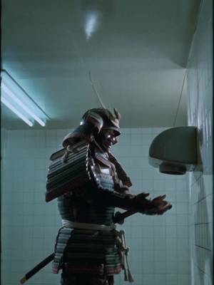 Samurai trying to use an automatic hand dryer