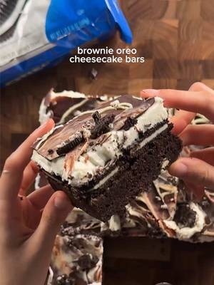 brownie oreo cheesecake bars brownie: 2 eggs 1/2 cup (42g) cocoa powder 1/2 tsp (3g) salt 1/2 tsp (2g) baking powder 1 1/2 tsp (6g) vanilla 1/2 cup (113g) unsalted butter 1 cup (200g) sugar 3/4 cup (95g) flour 1/2 cup (60g) crushed oreos *cream butter and sugar, then microwave gradually until sugar dissolves and is shiny. set aside to cool a bit. in a separate bowl mix eggs, cocoa, salt, baking powder, and vanilla. combine the egg and butter mixtures well, then add flour and oreos. pour into pan (I used 9x9) and bake at 350 for 27-30 minutes. take out of oven and carefully layer on whole oreos. set aside to cool. cheesecake layer: 12oz cream cheese, softened 1/2 cup (100g) sugar 1 tsp (4g) vanilla 1/4 cup (60g) sour cream or greek yogurt pinch of salt 1 cup (240g) heavy cream, cold +layer of oreo cookies *cream together cream cheese and sugar. then add in greek yogurt, vanilla, and mix until smooth. pour overtop of the baked brownie with cookies on top. chill in fridge 6hrs or overnight. optional: after chilling, pour on melted chocolate and crushed oreo pieces. #brownie #oreo #cheesecake #Recipe 