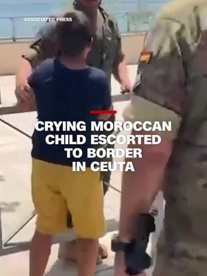 Video shows Spanish soldiers escorting a sobbing Moroccan boy toward Ceuta’s border with Morocco. It comes days after around 60,000 migrants charged into the Spanish exclave. #ceuta