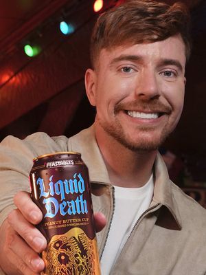 Liquid Death teamed up with Feastables and MrBeast to make better-for-you soda that tastes just like drinking Feastables Creamy Peanut Butter Cups. Grab it in tallboys or 12oz cans at retailers everywhere or on Amazon right now.